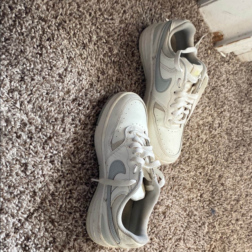 White and gray nike shoes